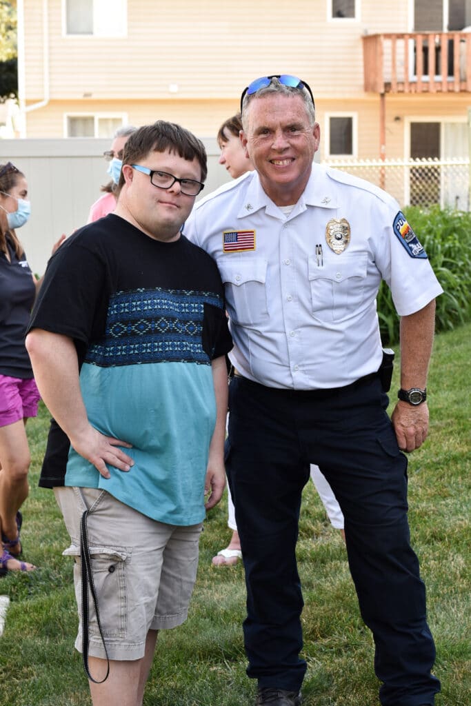 gentleman and police chief, Tom Williams, smiling and posing for photo